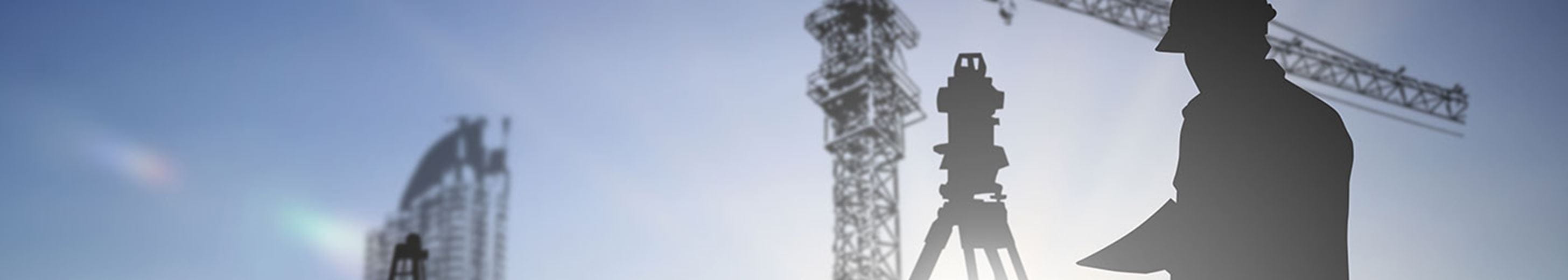 silhouette black man survey and civil engineer stand on ground working in a land building site over Blurred construction worker on construction site.