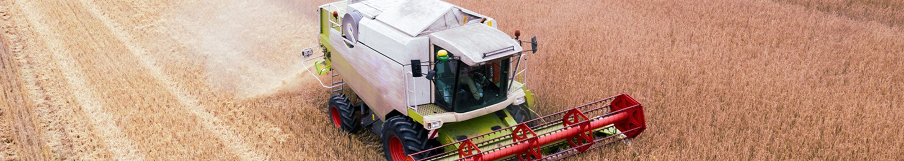 Tractor harvesting a field