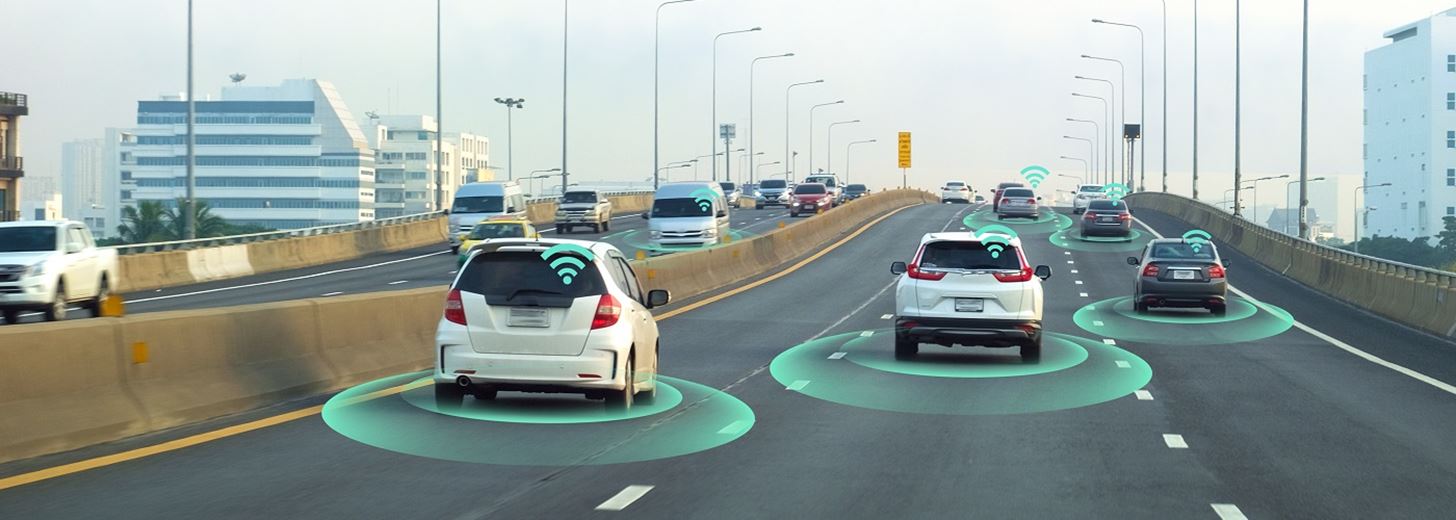 three self driving cars on a highway with wifi signs illuminated above them